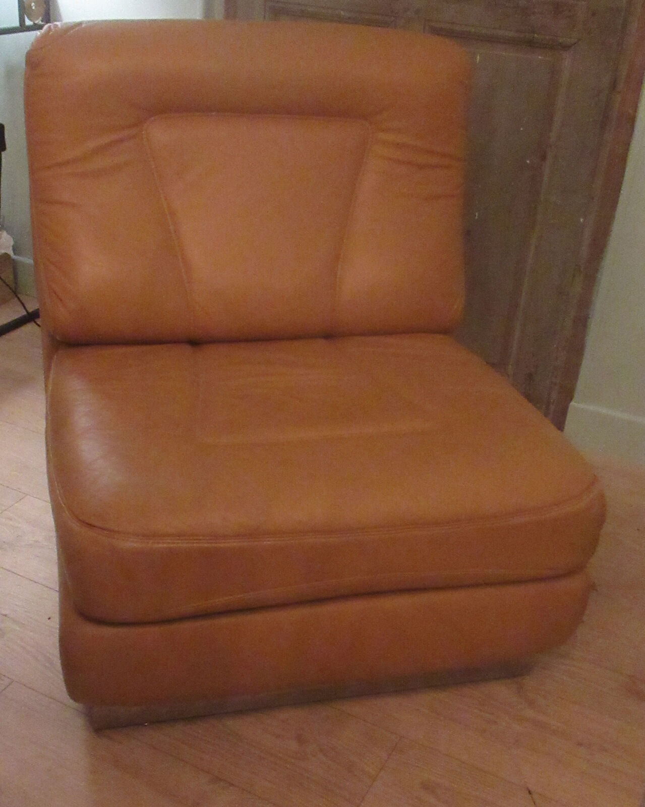 Leather armchair, stainless steel base, 70s
