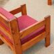 Pair of pine fireside chairs, France, 1960s, "raspberry" cushions