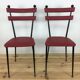 Pair of 1950s chairs in metal and red faux leather, Gueden-Adnet style.