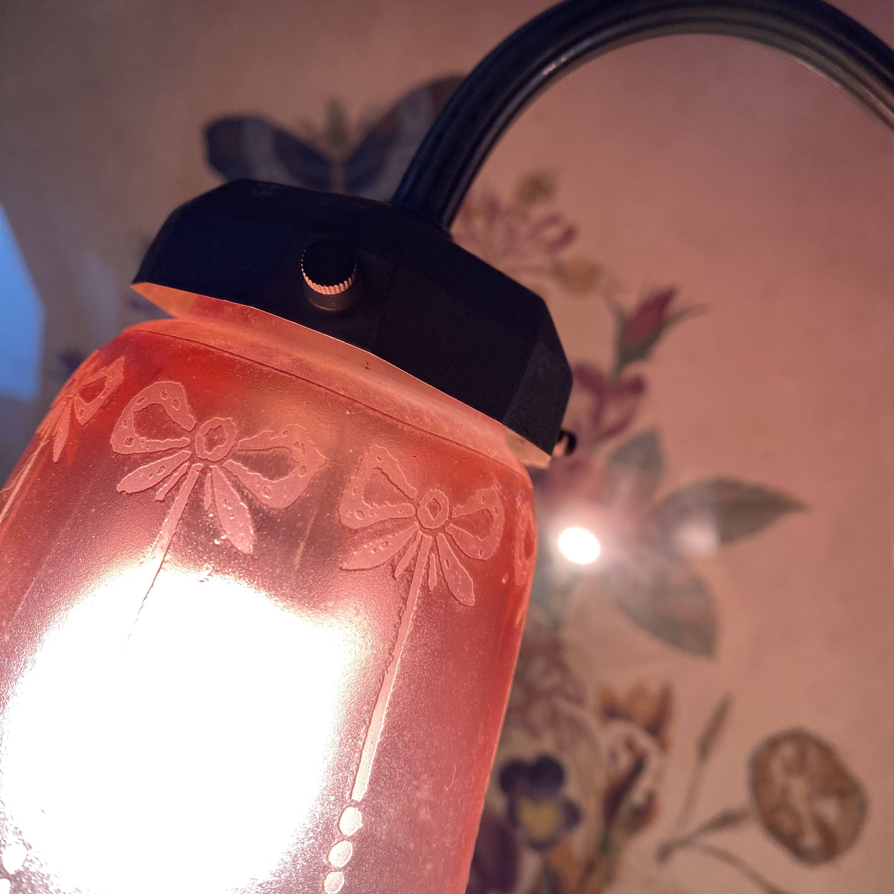 Antique jeweller's lamp, silver-plated base, frosted pink glass shade.