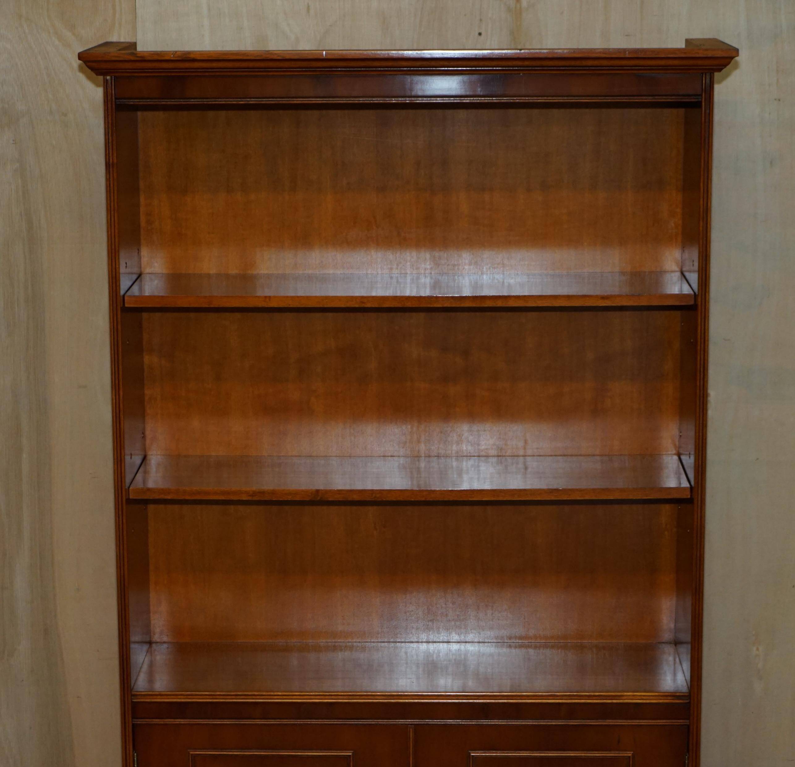 Open library Bradley Furniture made of yew wood with a cupboard base.