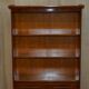 Open library Bradley Furniture made of yew wood with a cupboard base.
