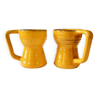 2 yellow enameled ceramic cups, signed