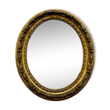 Large golden oval mirror