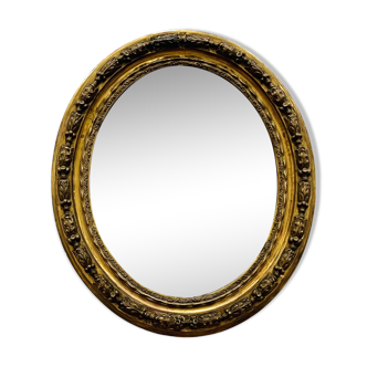 Large golden oval mirror