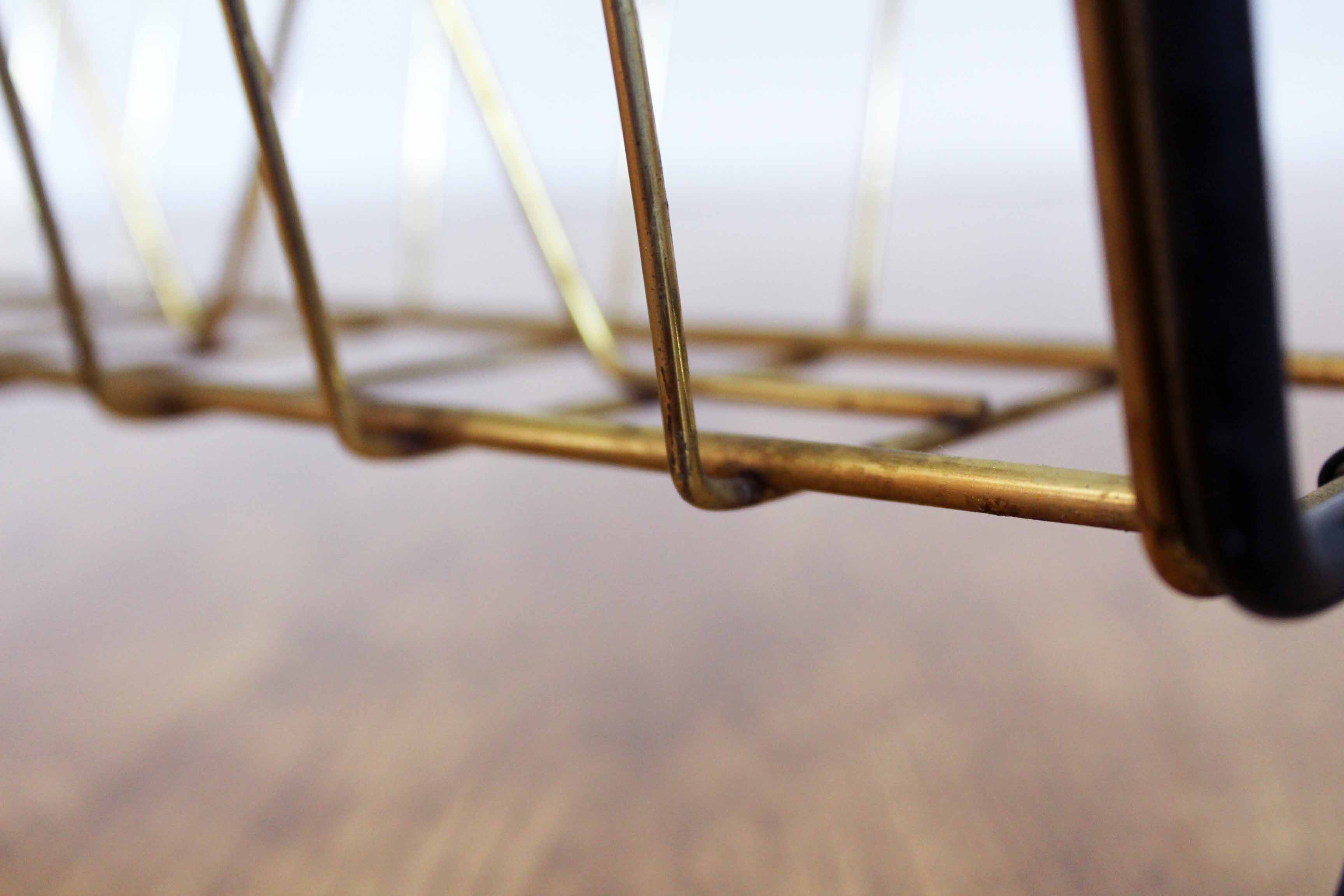 Metal magazine rack, wooden handle
