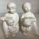 Pair of bookends with a matte white glaze for children.