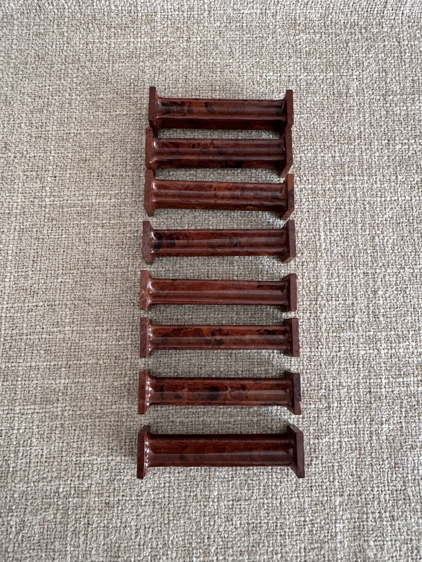 Set of 8 Bakelite knife rests with mahogany effect Art Deco