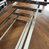 70s design coffee table in rectangular glass with chrome legs.