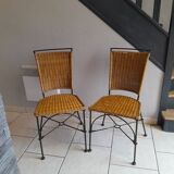 Pair of vintage wrought iron and rattan chairs