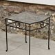 Petite table d'appoint en fer forgé et verre fumé