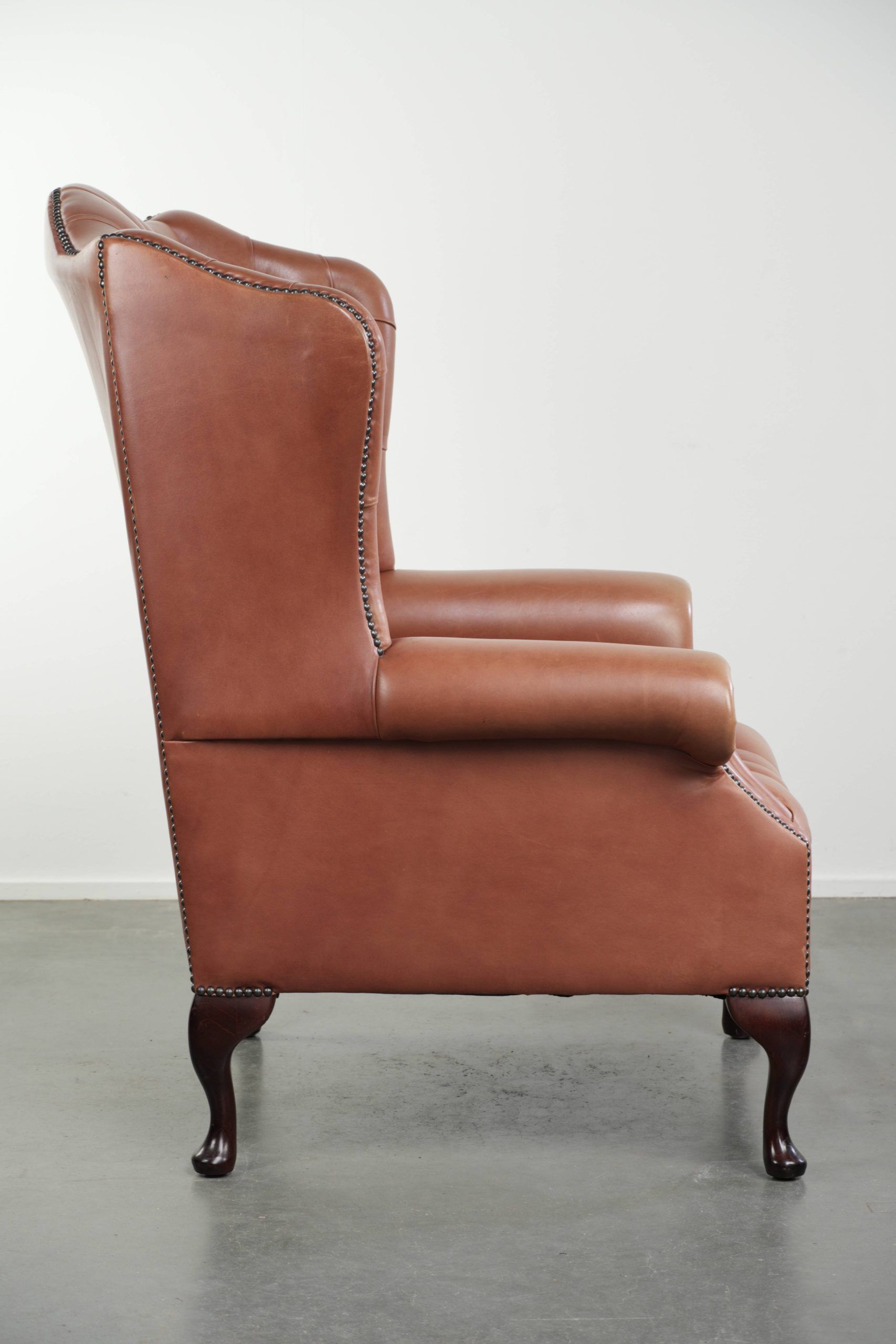 Classic English cowhide button seat chesterfield wingback armchair