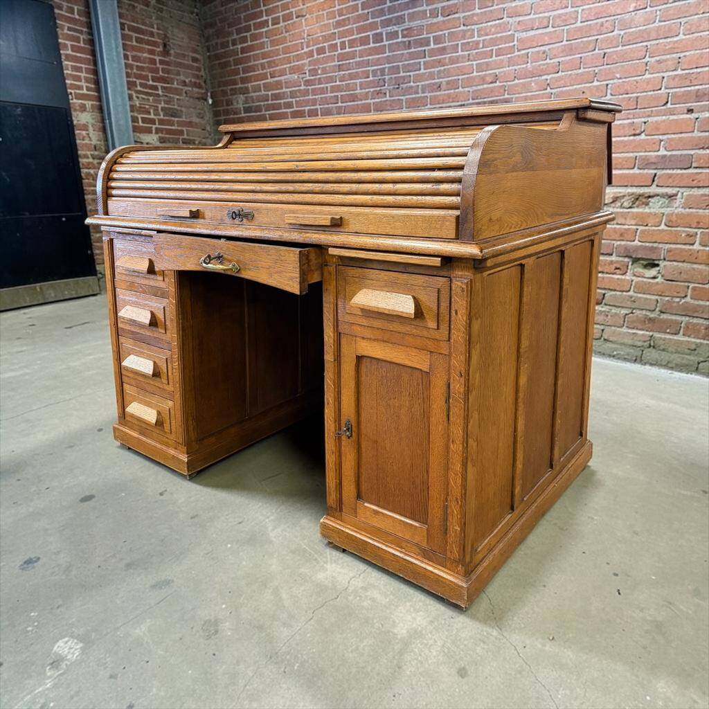 Vintage American desk made of solid wood with a curtain.