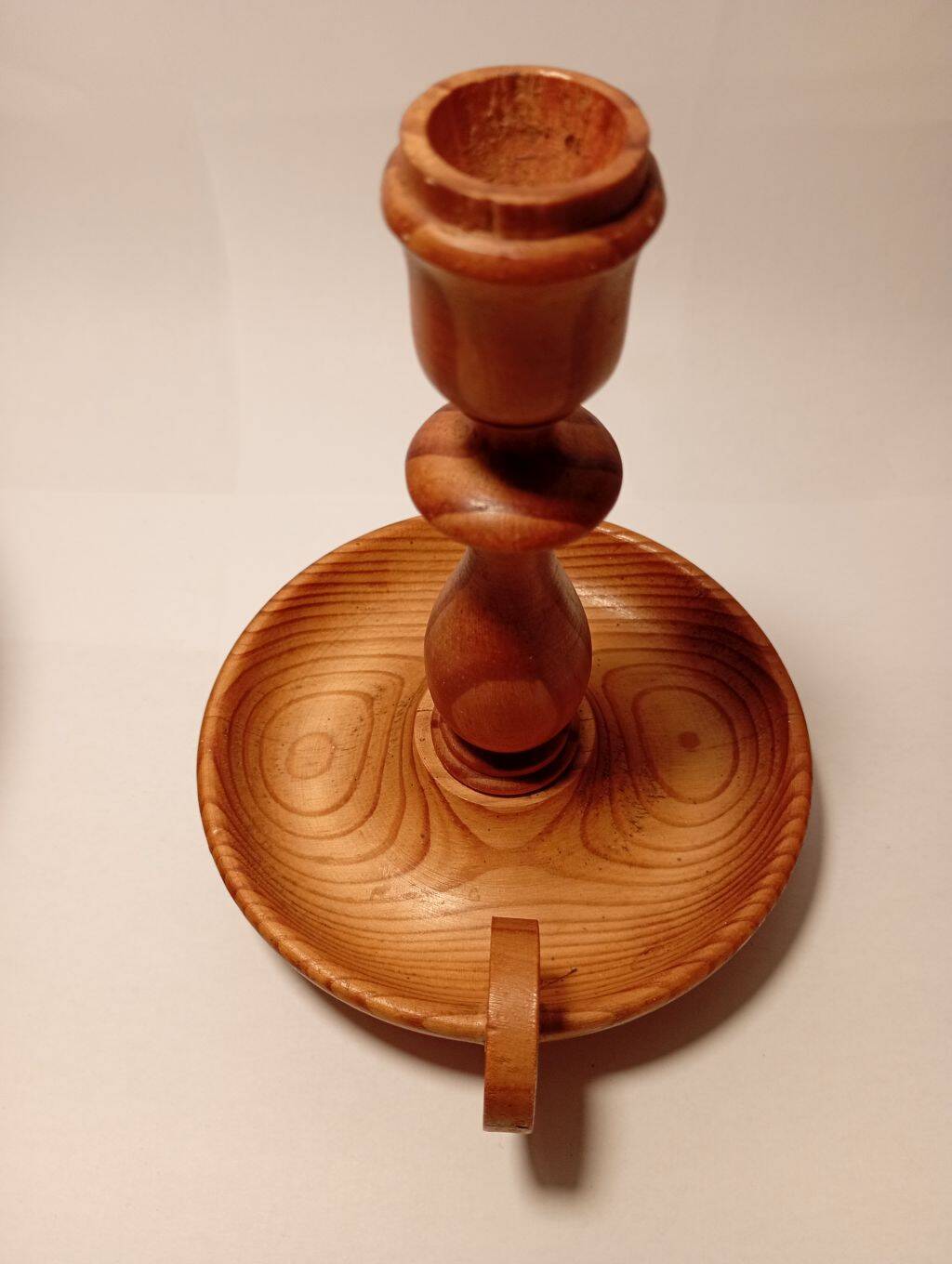Vintage candlestick holder crafted from turned pine wood Scandinavian-style