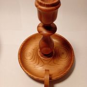 Vintage candlestick holder crafted from turned pine wood Scandinavian-style
