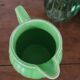 Green ceramic jug