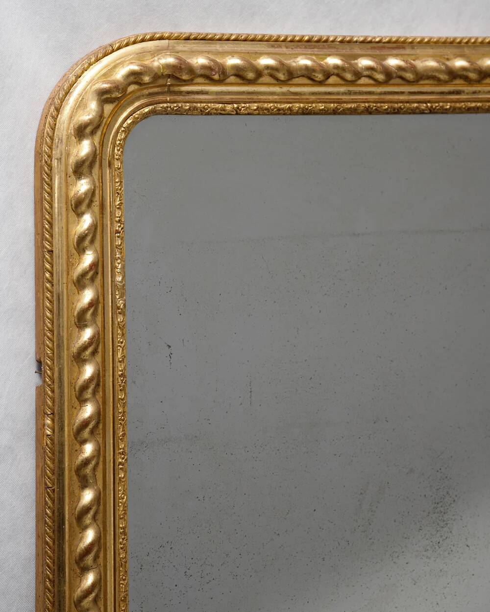 Louis-Philippe mirror with a geometric scalloped frame