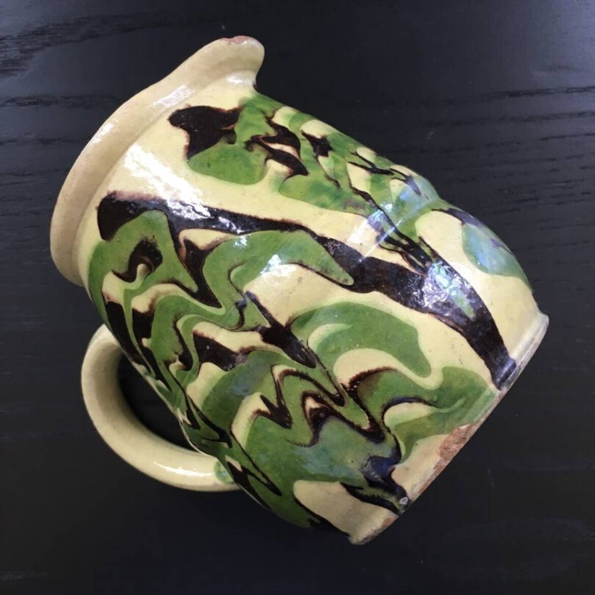 Antique pitcher of mixed earth