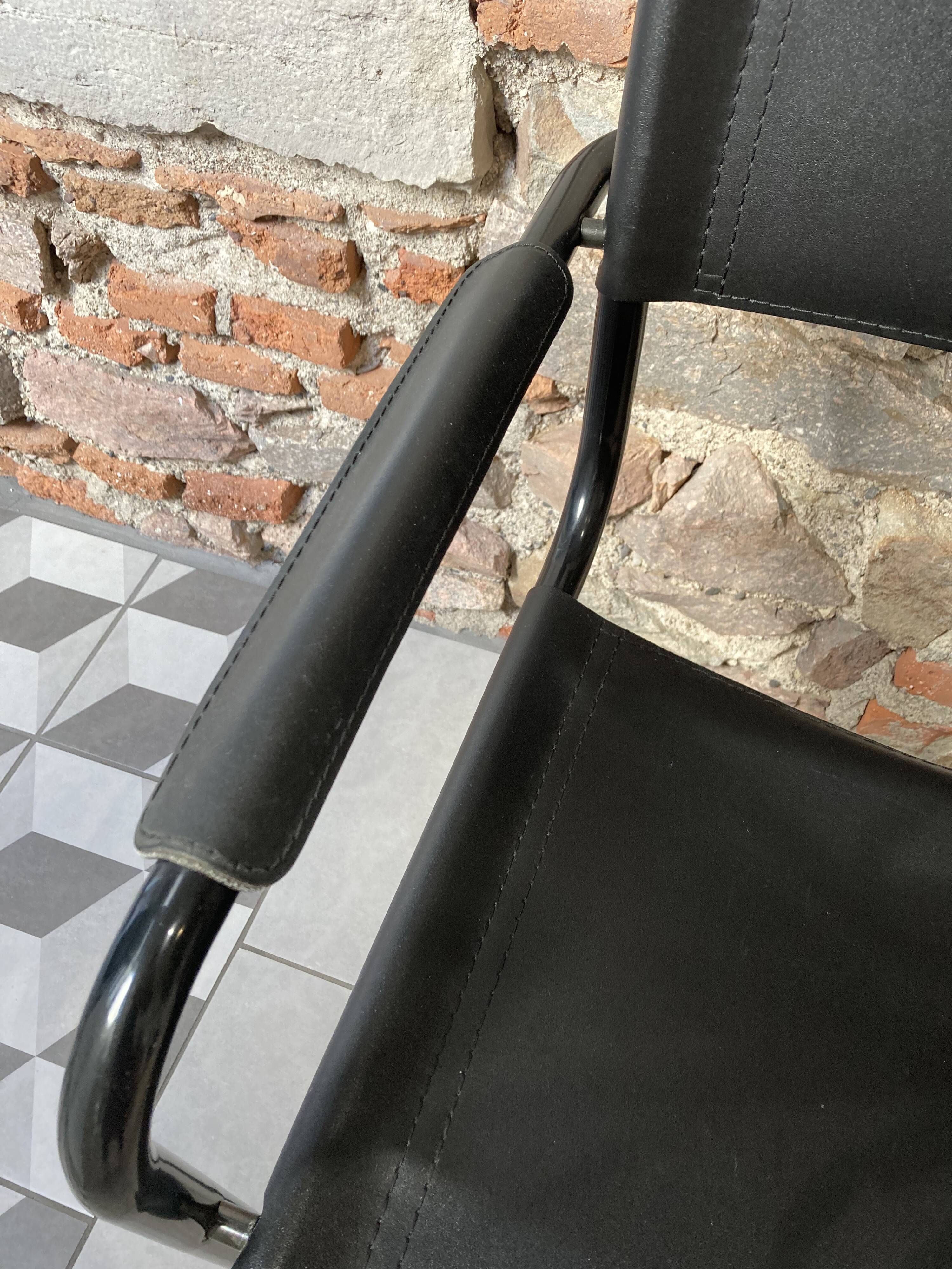 Armchair in black lacquered metal