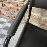 Armchair in black lacquered metal