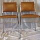Pair of modernist chairs in chromed metal and imitation leather