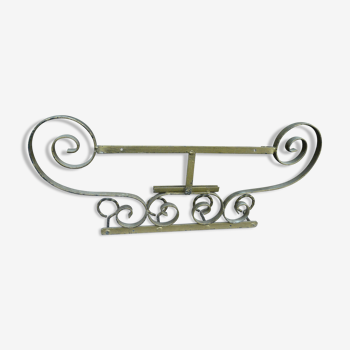 Wall mounted wrought iron coat rack from the 1970s