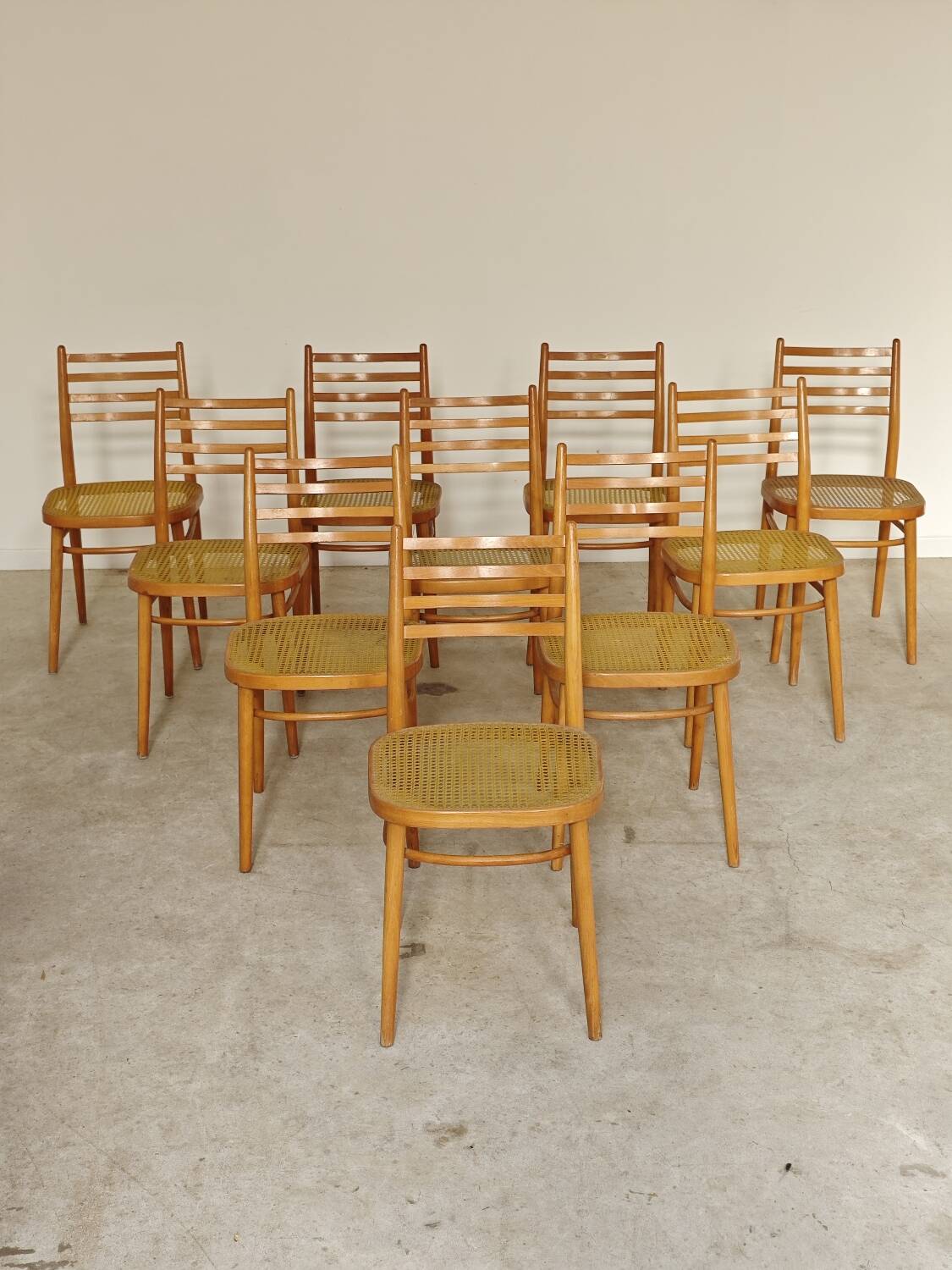 Set of 10 Bystrice tone wooden and caned chairs from the 1960s.