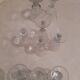 Set of 9 small cut glass stemmed glasses from the 1930s, in various sizes.