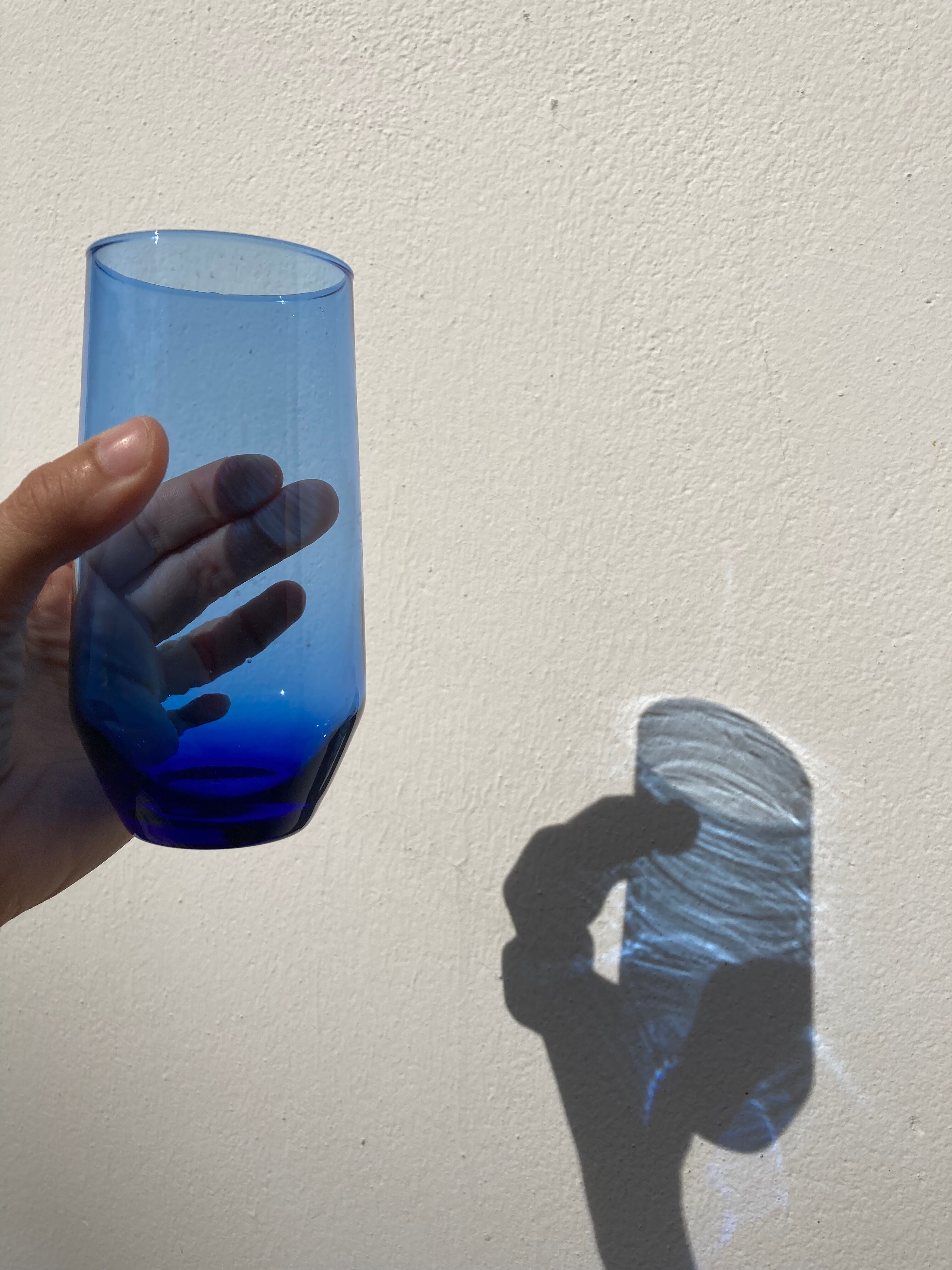 Crystal coloured water glasses in gilded metal glass holders 1970