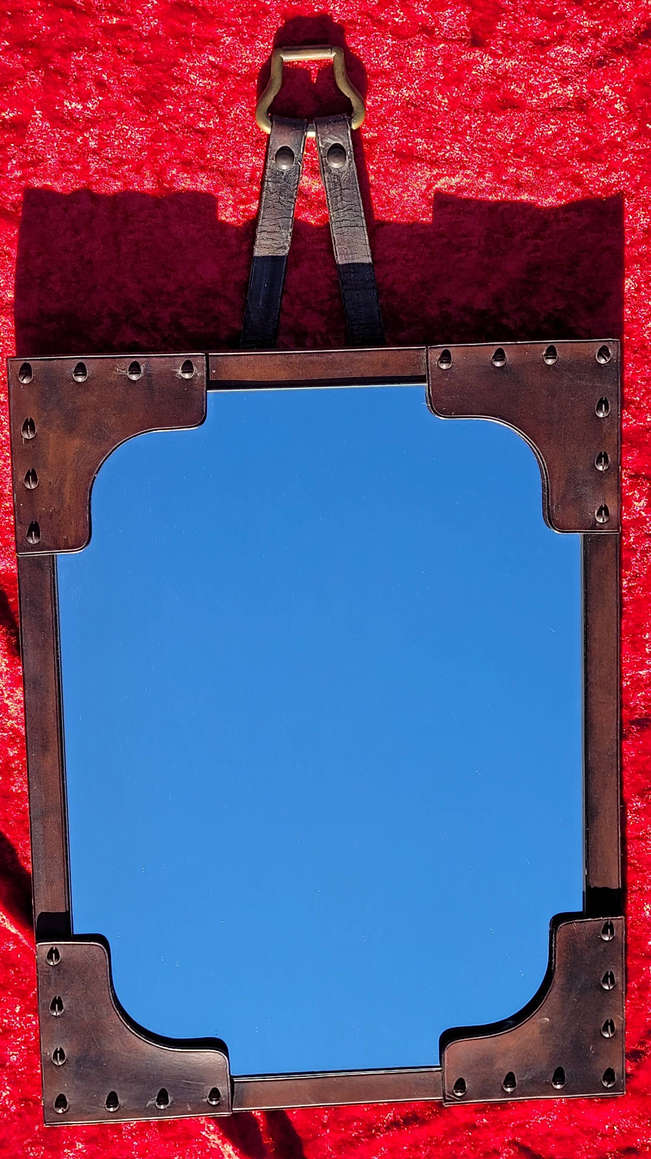 Leather-covered wall mirror attributed to Jacques Adnet 1950