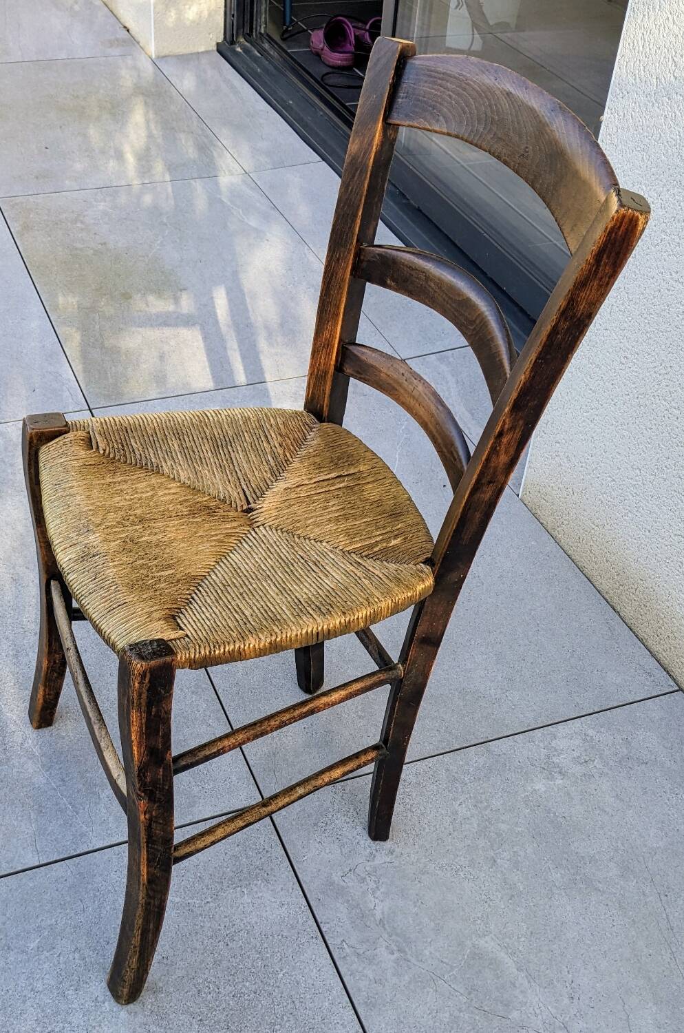 4 mismatched wood and straw chairs
