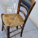 4 mismatched wood and straw chairs