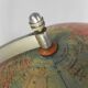 Paper mache globe on a wooden base, 1975