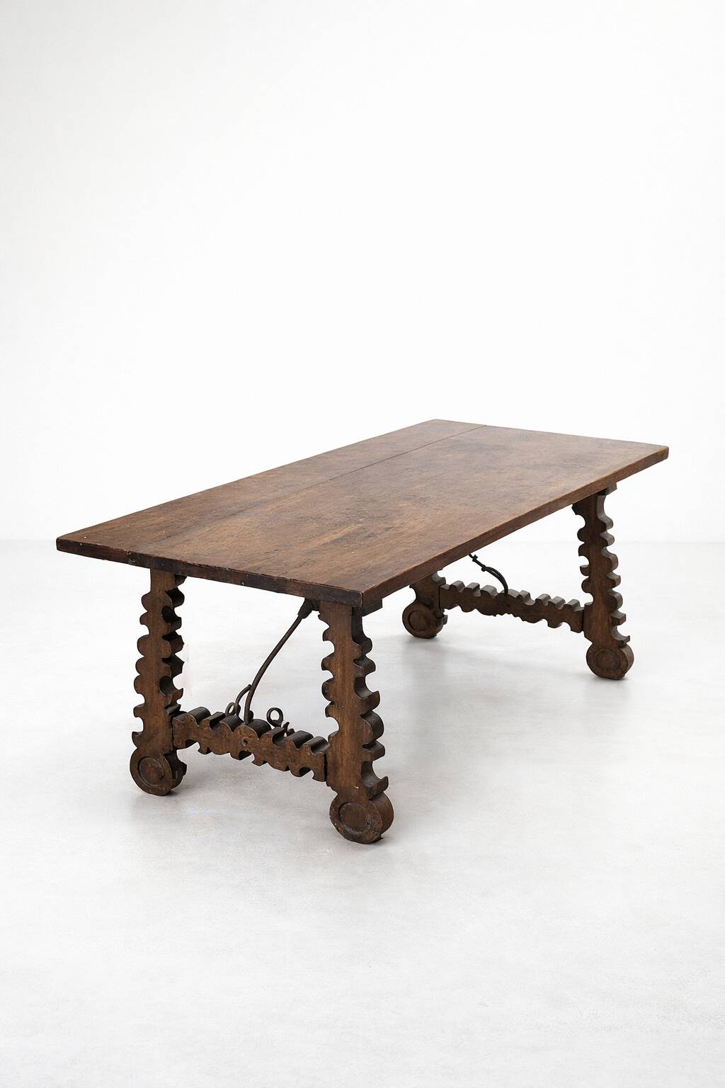Spanish table in walnut and wrought iron, lyre-shaped base.