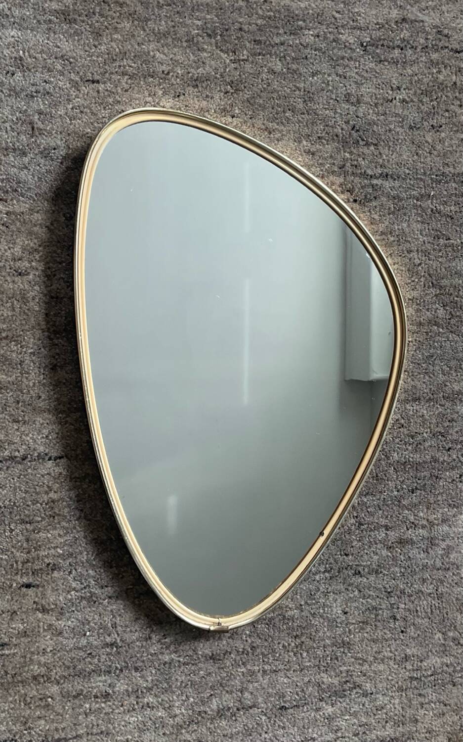 Asymmetrical free-form mirror from the 60s-70s.