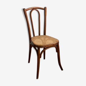 Caned chair and curved wood
