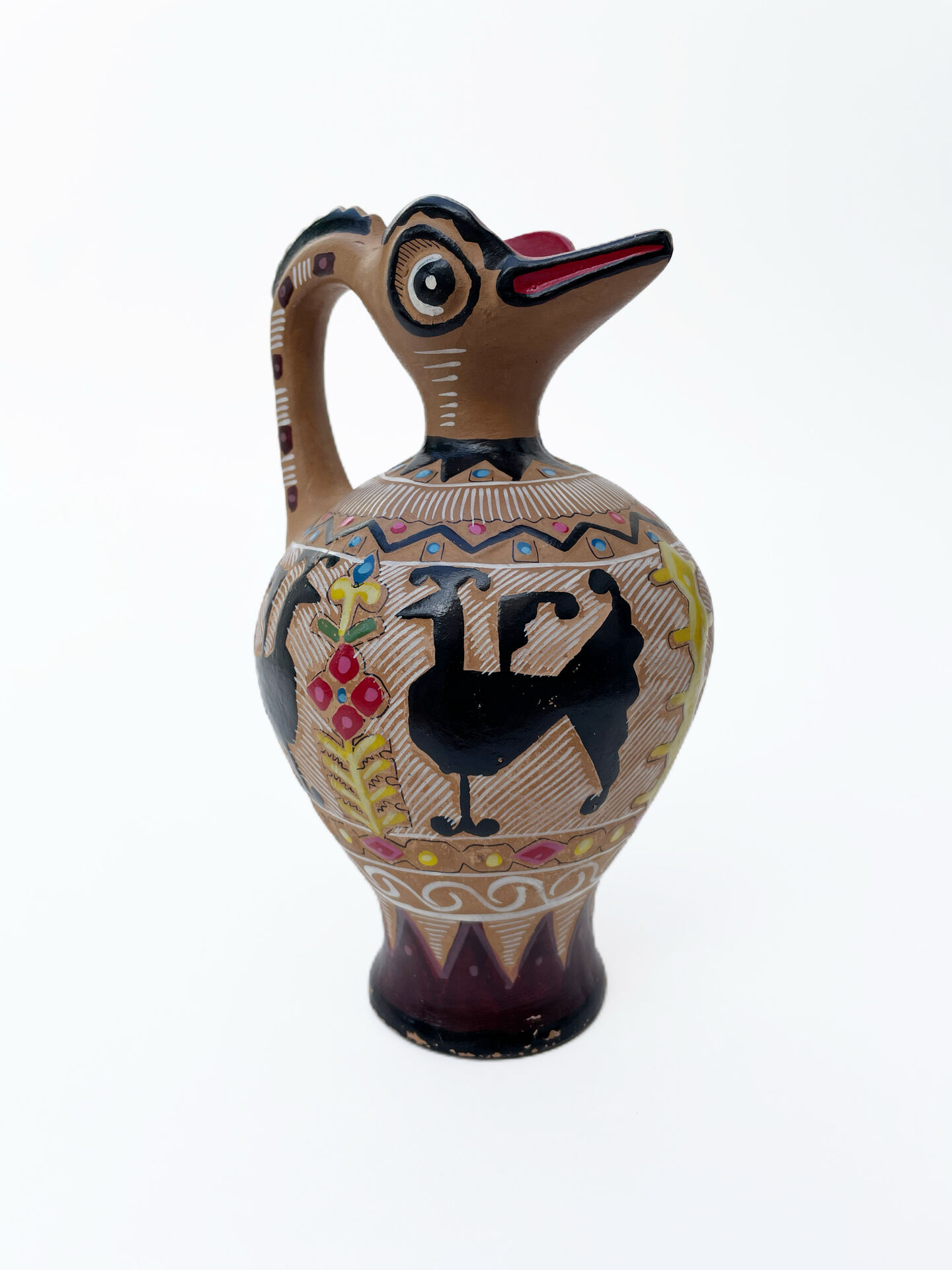 Clay pitcher with a bird head