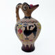 Clay pitcher with a bird head