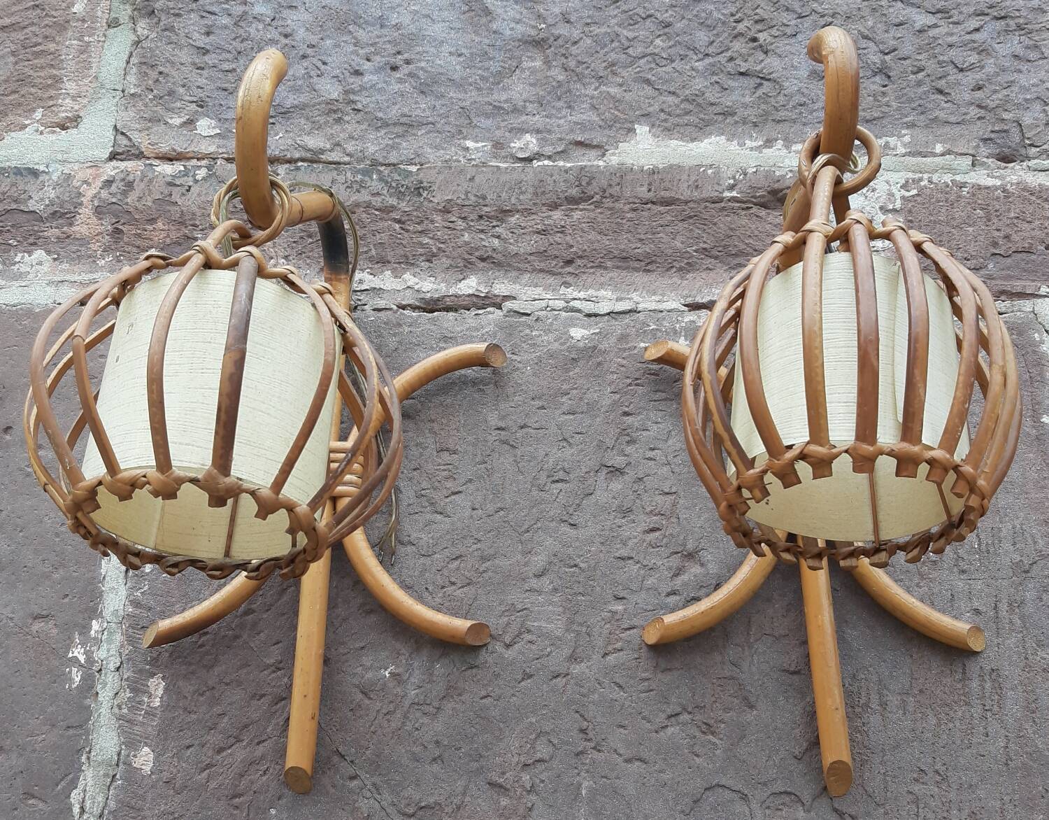 Pair of Louis Sognot rattan wall lights.