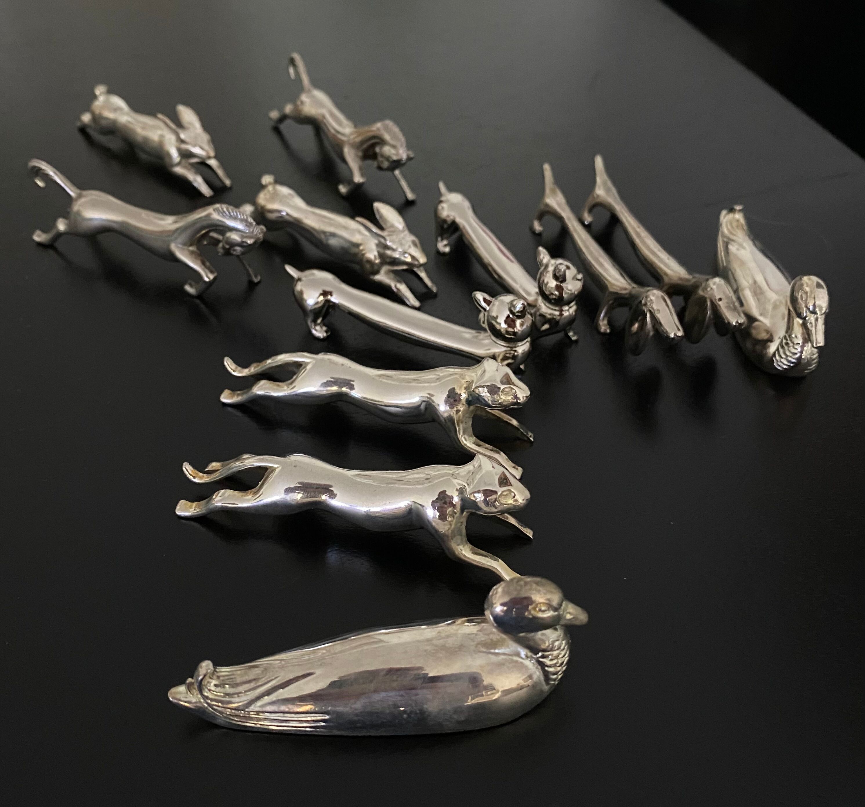 12 knife holders form various metal animals