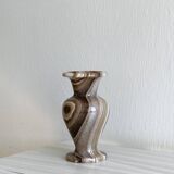 Natural stone vase with marbled patterns.