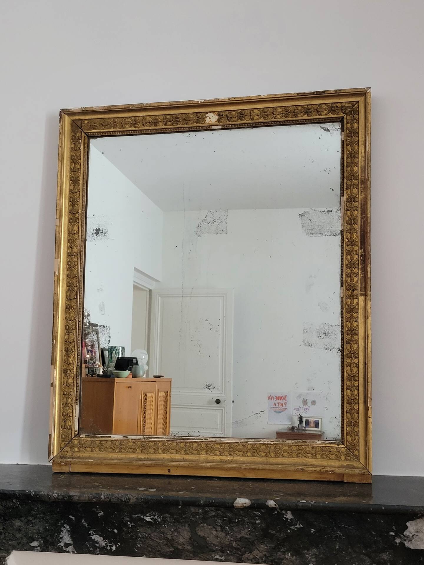 Golden stucco and wood Empire mirror