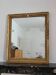 Golden stucco and wood Empire mirror