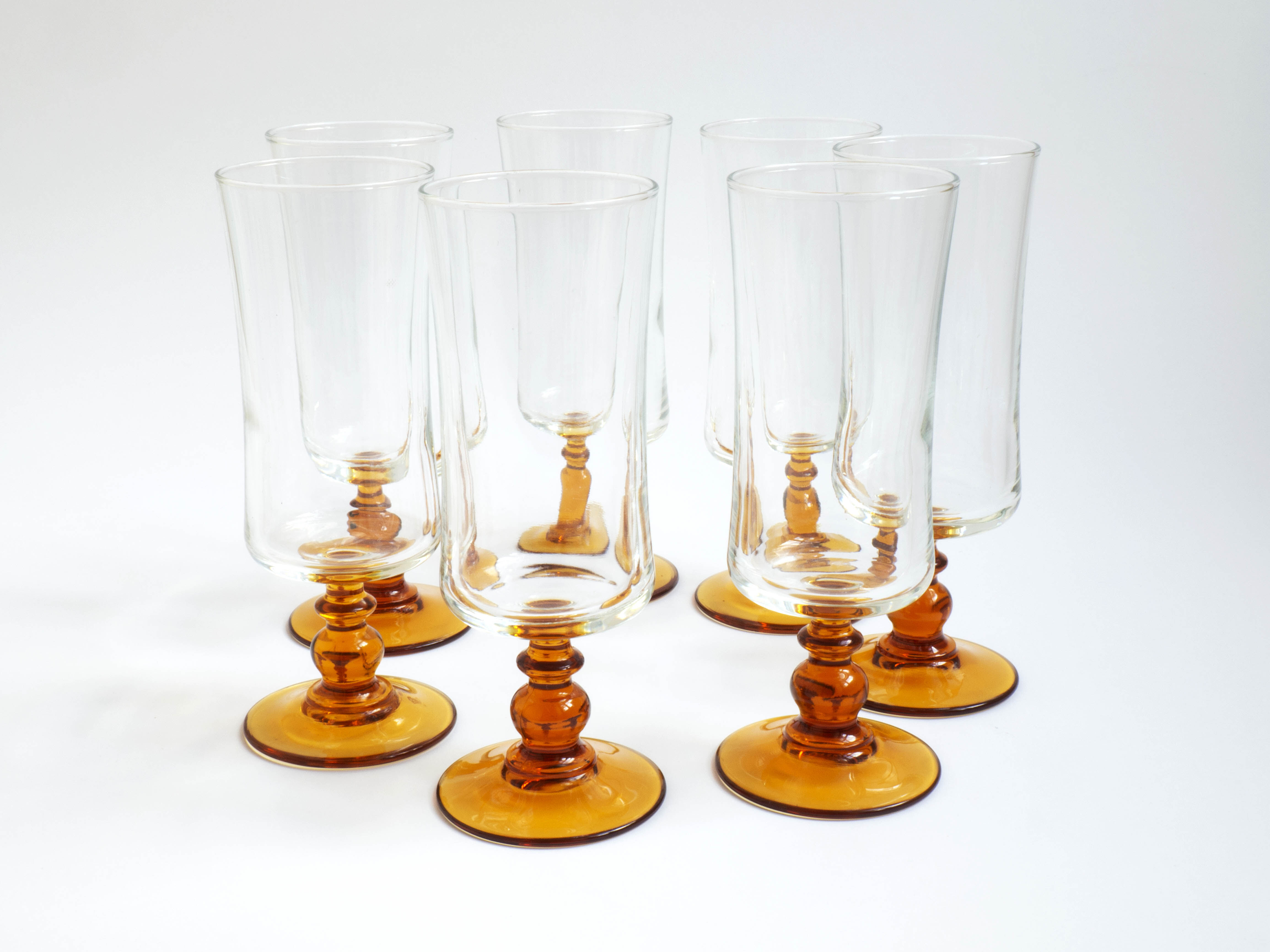 Glasses/flutes with a vintage orange foot