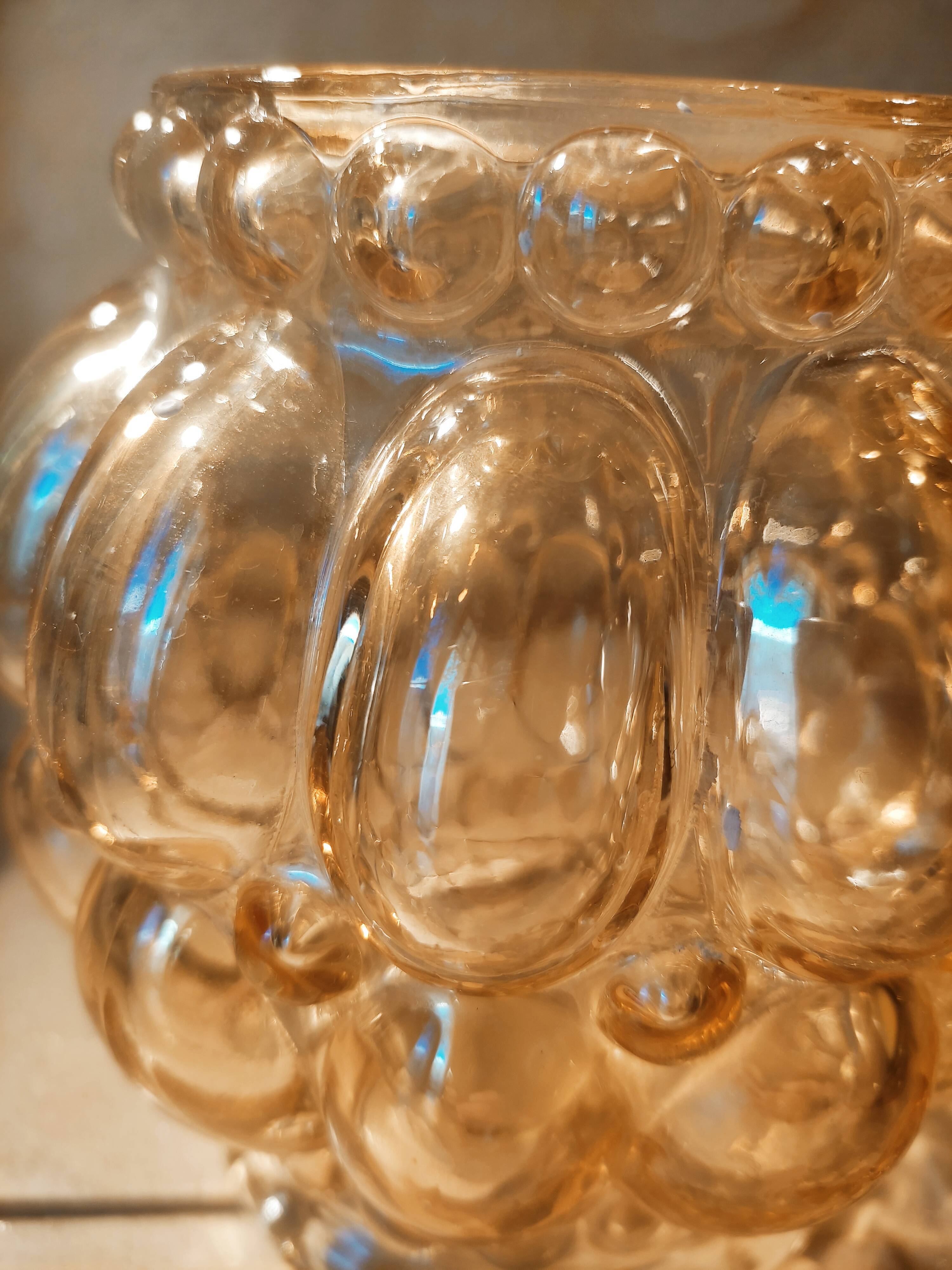 Tulip in iridescent golden glass