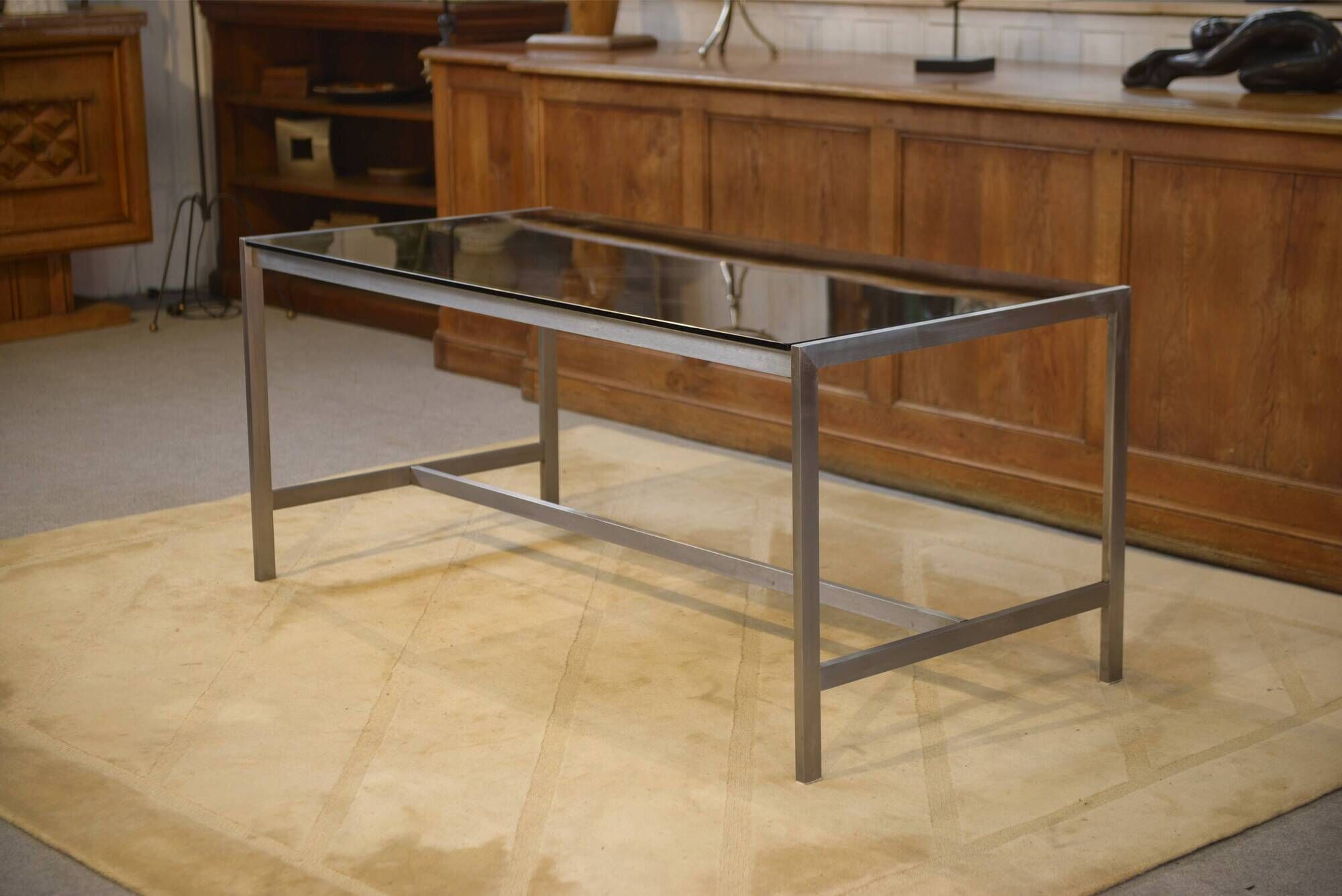 Brushed stainless steel and smoked black glass desk from the 1980s.
