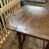 Wooden table with gateleg flaps