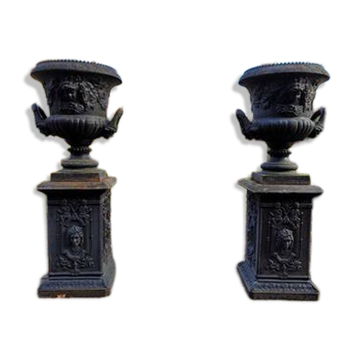 Large antique cast iron planters on pedestal jardiniere