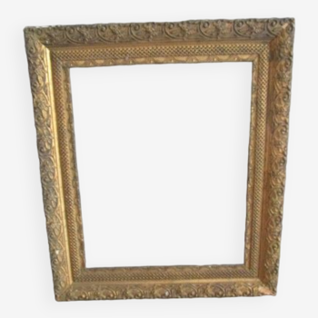 Old frame in wood and gilded stucco