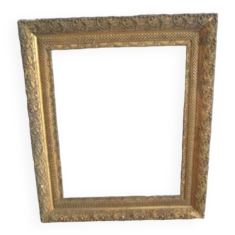 Old frame in wood and gilded stucco